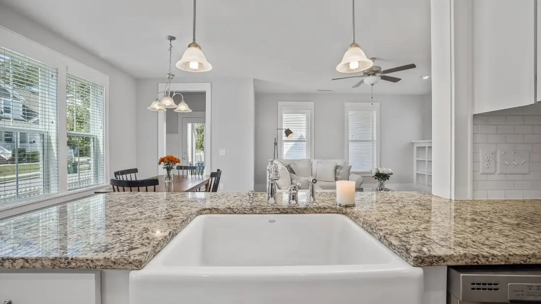 A grey concrete kitchen countertop with integrated sink