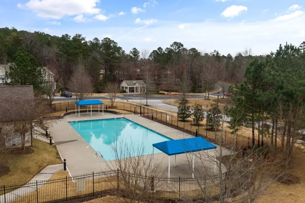 A concrete pool surround finished in a smooth grey tone