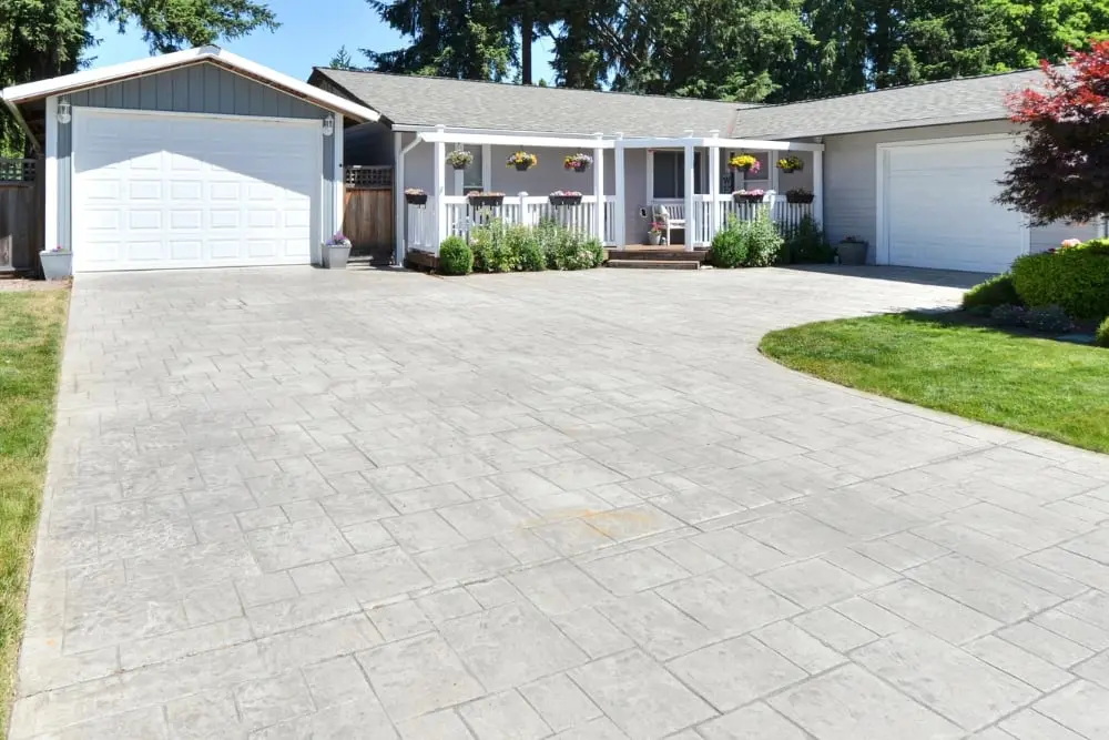 A concrete driveway crossing from the footpath to a home garage