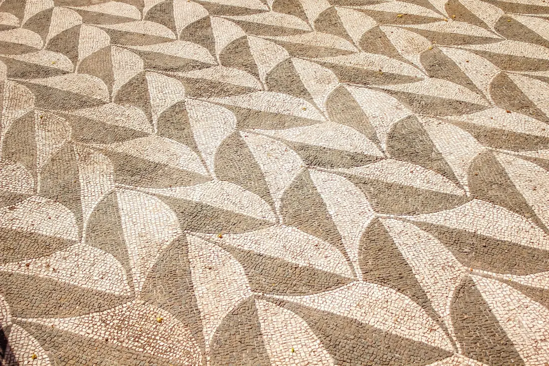 A patio finished with stamped concrete in a stone-look pattern