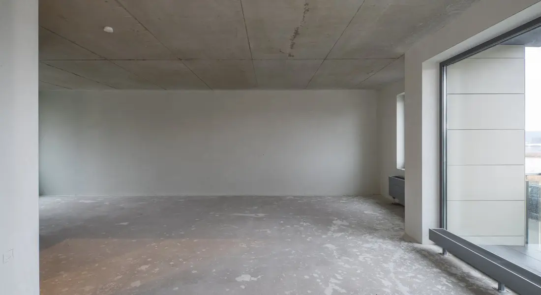 A polished concrete floor finish inside a modern living space
