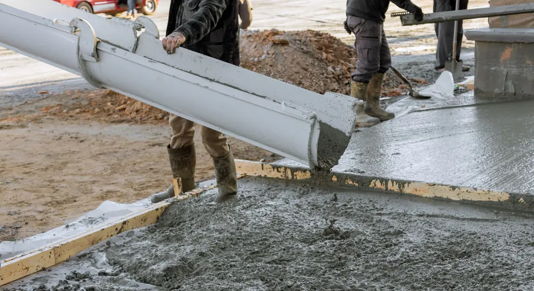 Basic concreting tools and materials laid out for a DIY pour