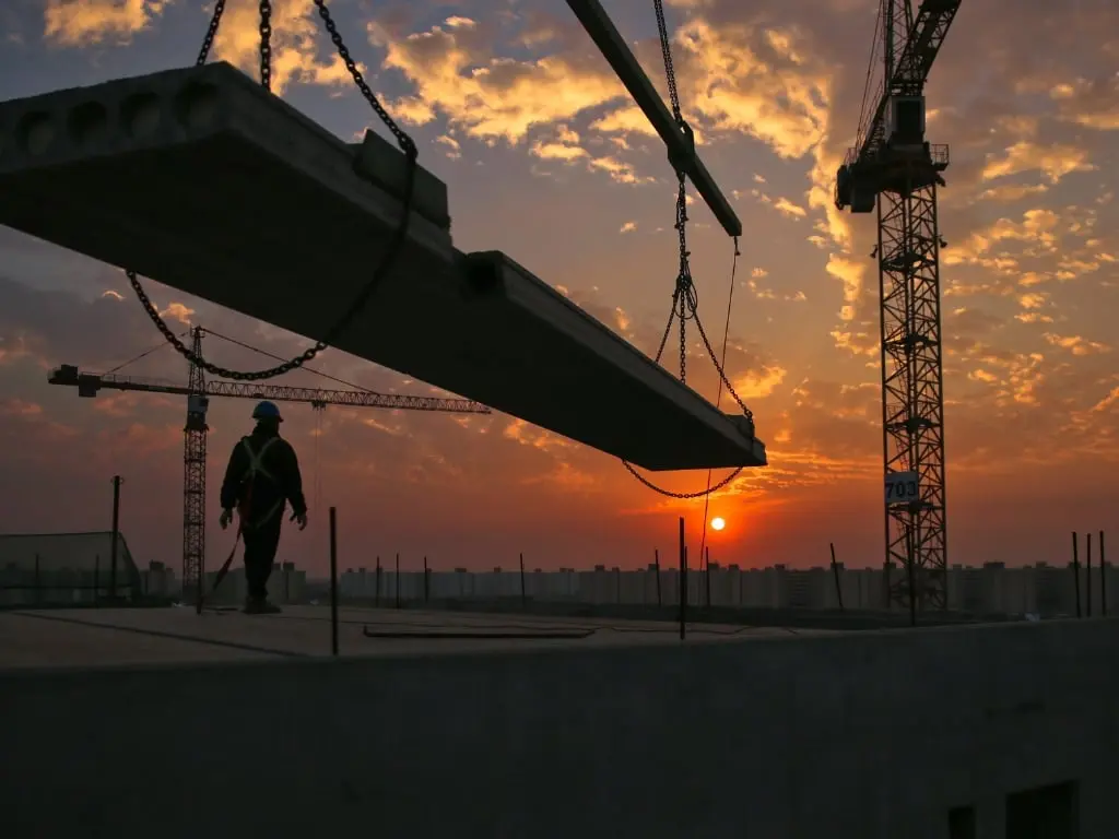 A modern concrete high-rise structure under construction