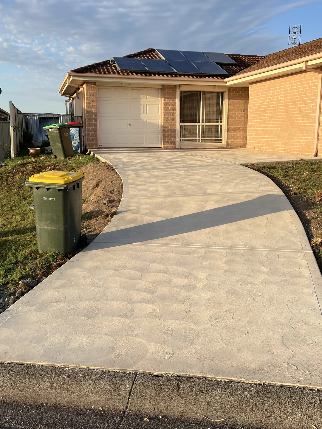 A finished decorative concrete driveway