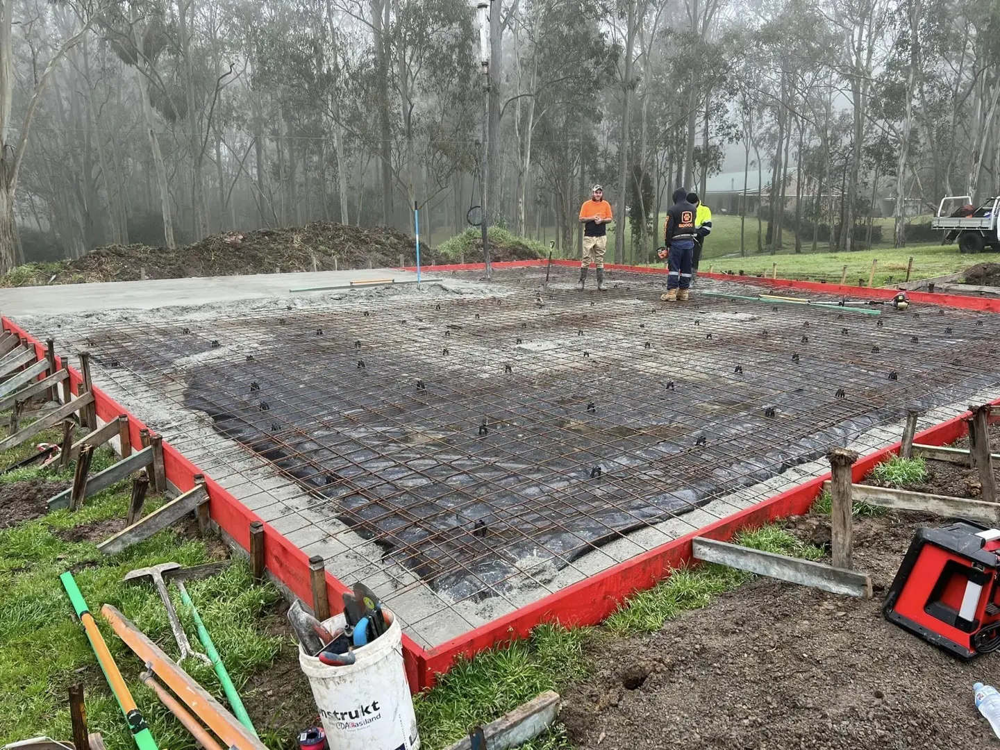 Con Ops crew setting out formwork and reinforcement mesh before a slab pour